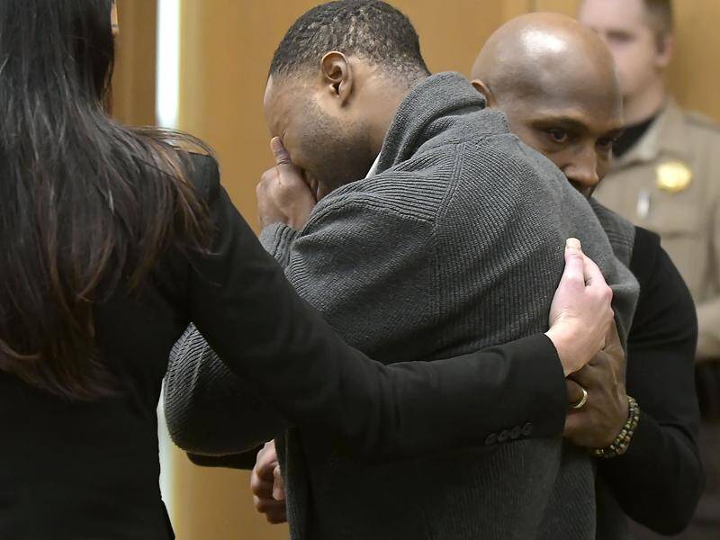 Torrey Green cries while being consoled by his lawyer after being found guilty of on eight counts.