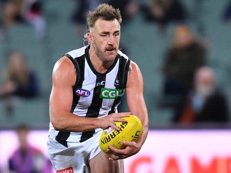 Lynden Dunn has called time on his AFL career after 198 games for Melbourne and Collingwood.