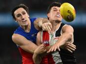 The Lions' Oscar McInerney and the Saints' Rowan Marshall compete for the ball in their AFL clash. (Joel Carrett/AAP PHOTOS)