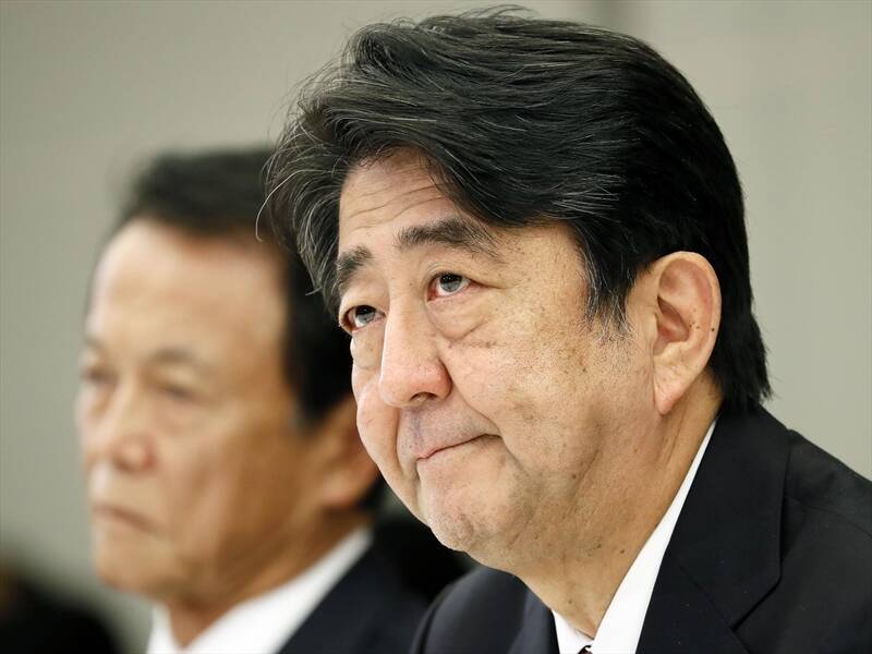 Japan's PM Shinzo Abe wants to confirm the identify of a Japanese journalist released in Syria.