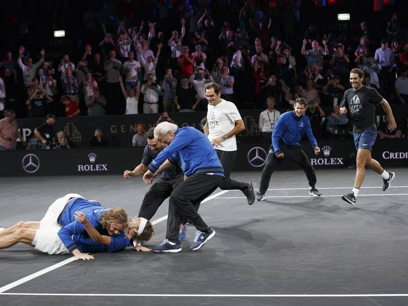 Alexander Zverev is mobbed by his Europe teammates after clinching the Laver Cup in Geneva.