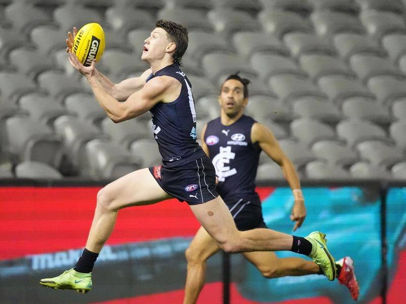 Carlton star Sam Walsh will miss at least the first month of the AFL season with an ankle injury.