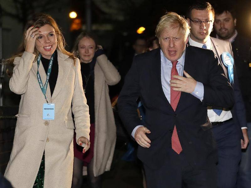 UK Prime Minister Boris Johnson and partner Carrie Symonds arrive for his constituency count result.