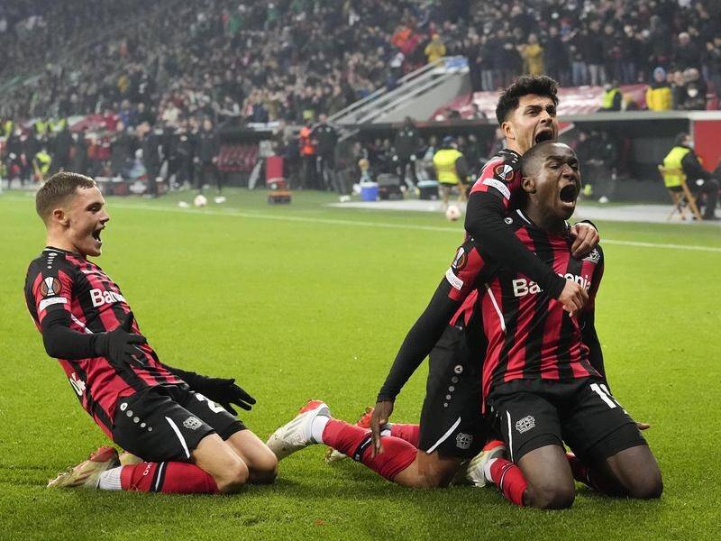 Moussa Diaby (r) celebrates Bayer Leverkusen's winner which sent Celtic out of the Europa League.