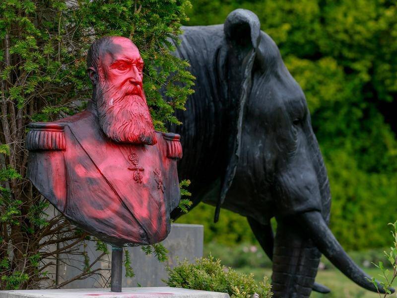 A statue of Belgium's King Leopold II sprayed with red paint.