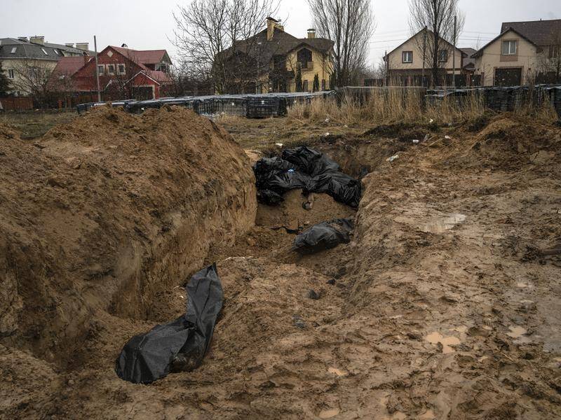 Bodies lie in a mass grave in Bucha, on the outskirts of Kyiv, Ukraine.