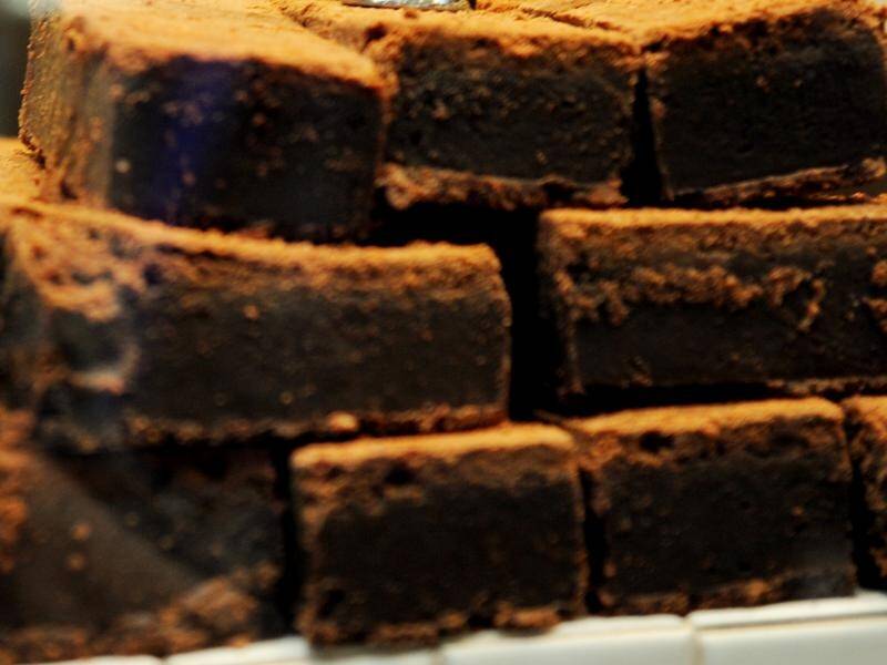 A Perth cafe owner denies selling two marijuana-laced brownies to a family.