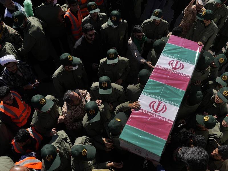 Crowds in Iran have mourned those slain in an Islamic State group-claimed suicide bombing. (AP PHOTO)