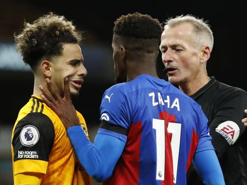 Wolves' Rayan Ait-Nouri (l) squares up with Crystal Palace's Wilfried Zaha in Friday's EPL clash.