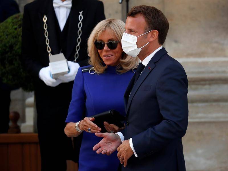 President Emmanuel Macron and his wife Brigitte after he gave a speech on the eve of Bastille Day.
