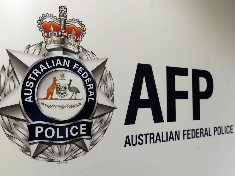 AFP officers have arrested a man in Perth for allegedly breaching his visa-mandated curfew. (Julian Smith/AAP PHOTOS)