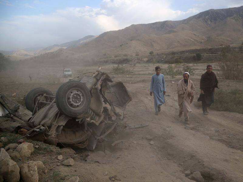 Eleven people have been killed in a roadside bomb blast on day two of Afghanistan's elections.