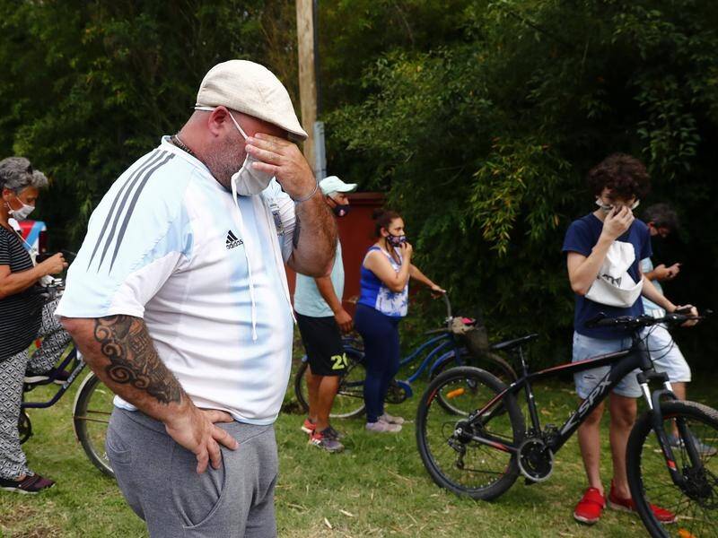 Mourners began to gather outside Diego Maradona's home in Buenos Aires after news of death broke.