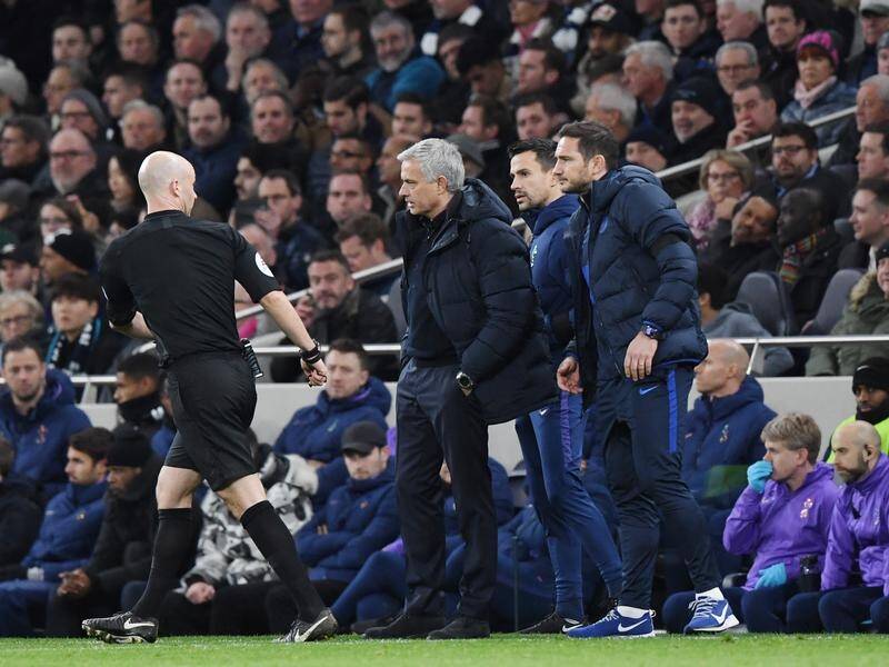 Referee Anthony Taylor speaks to Tottenham boss Jose Mourinho and Chelsea manager Frank Lampard.