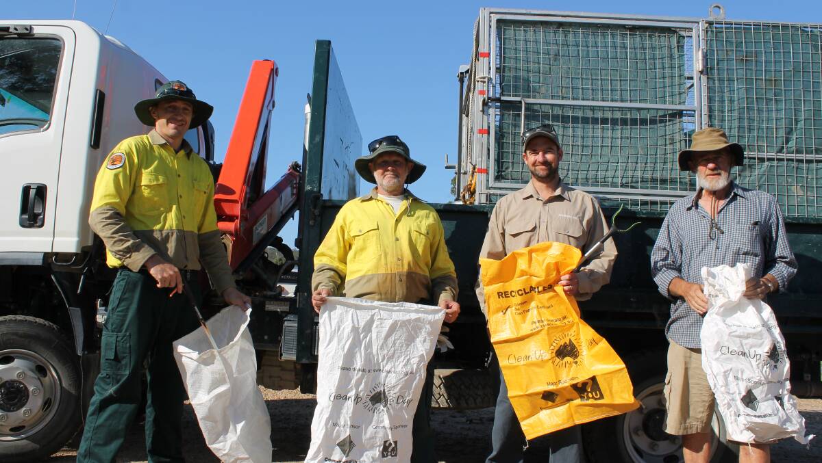 NPWS staff Simon Conaty and Darryl Bills, Luke Brown of the Bournda Environmental Education Centre and community volunteer Bob Brown are ready to begin the clean up on Sapphire Coast Drive on Sunday.