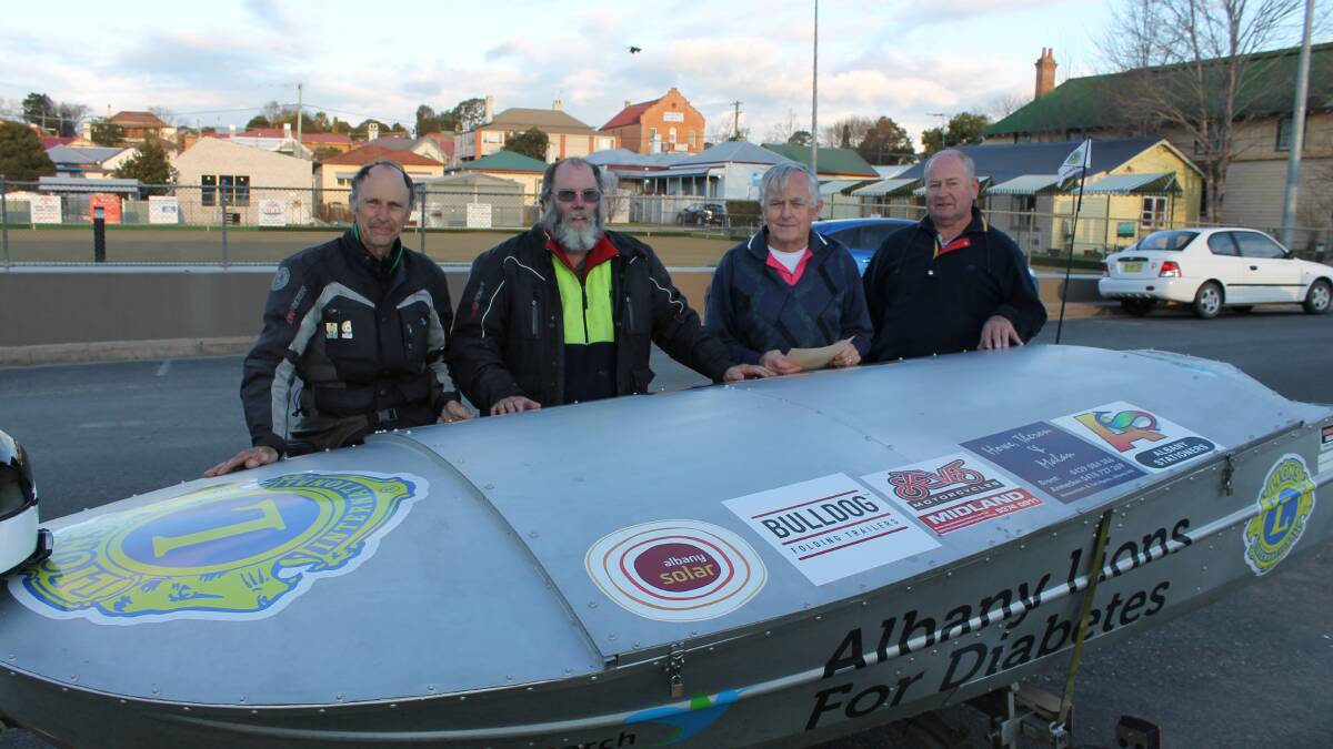 Intrepid motorcyclists Guy Cook and Glen Hurst from the Lions Club of Albany are greeted by Bega Lions Peter Wiley and Keith Underhill in Bega on Wednesday afternoon.
