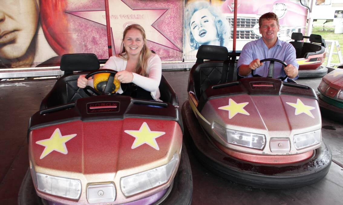 Bega AP&H Society vice-president Jacinta Day and president Norm Pearce test out the dodgem car rides on Wednesday. The Far South Coast National Show in Bega begins this Friday.