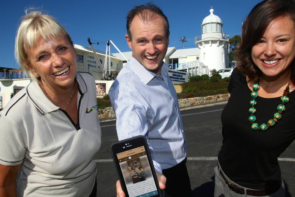 Bega Valley Shire Council general manager Leanne Barnes, 2pi Software CEO Liam O’Duibhir and Sapphire Coast Tourism’s Sarah Chenhall trial the “Eden Trail” mobile phone app at the Eden Killer Whale Museum.