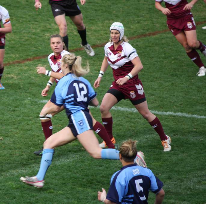 Kezie Apps makes a break during a State of Origin game in July