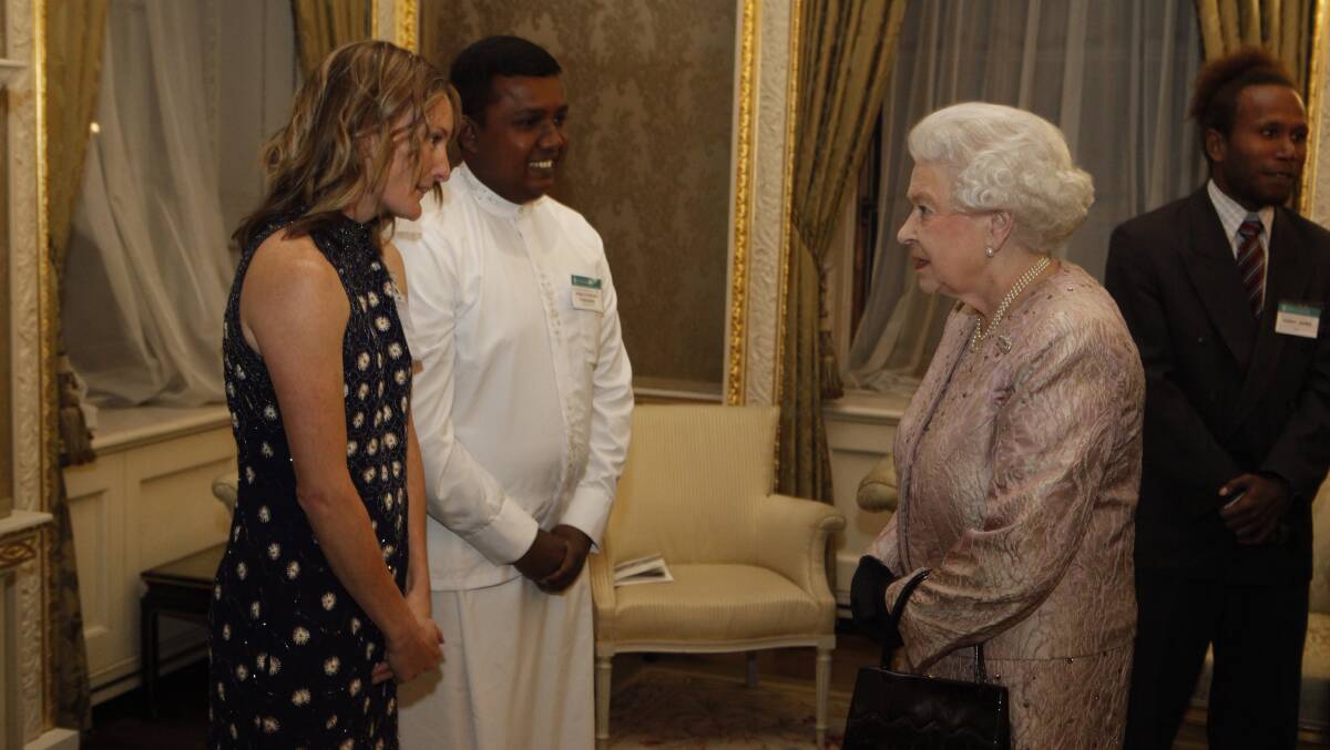 Ellie Seckold speaks with Her Majesty Queen Elizabeth II at the Commonwealth Day reception in London. Commonwealth Secretariat photo by Richard Lewis.