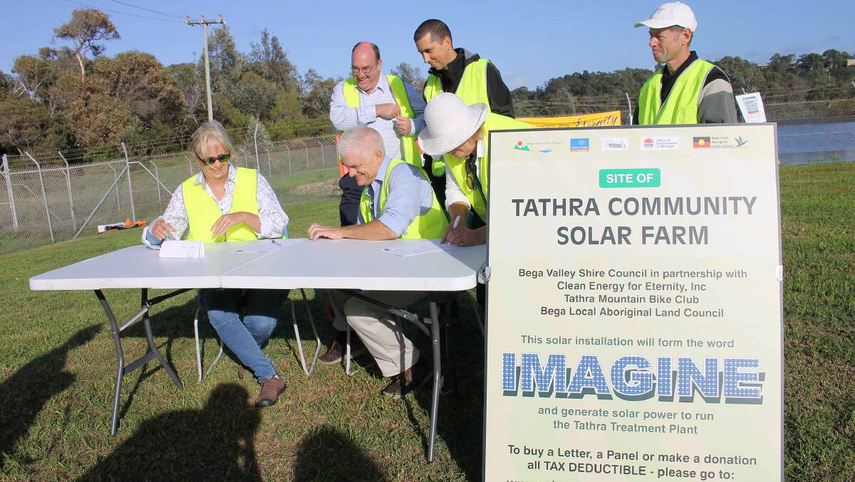 BVSC general manager Leanne Barnes and CEFE founder Matthew Nott sign the memorandum of understanding for the Tathra community solar farm.