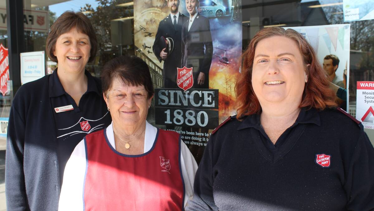 Salvation Army Lieutenants Karen Harrison and Lesley Newton, and Bega Salvos store staff member Dot Chapman (middle), discuss next week’s Red Shield Appeal.