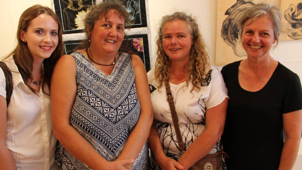 At the International Women's Day art exhibition are (from left) Lauren Jolley, Christine Quinton, Angela Robbers and Zanette Bur.