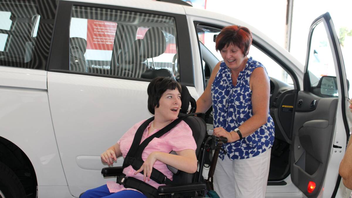 Colleen and Janelle Barrett look at their new fully converted disability access Kia Carnival which they received at Tarra Ford on Monday.