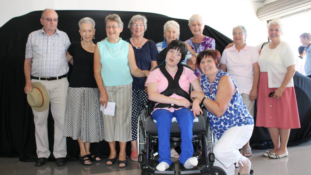 Members of the Wyndham Hymn Singers with the Barrett family at the unveiling of a fully converted disability access vehicle for Colleen, (from left) Frank Elton, Andy Cross, Aileen Trezise, Alice Elton, Colleen's grandmother Barbara Brand, Lyn Scyrmgeour, Nancy Grant and Norma Wright, with Colleen and Janelle Barrett. Members Mary Payne and Carolyn Griffiths were unable to attend.