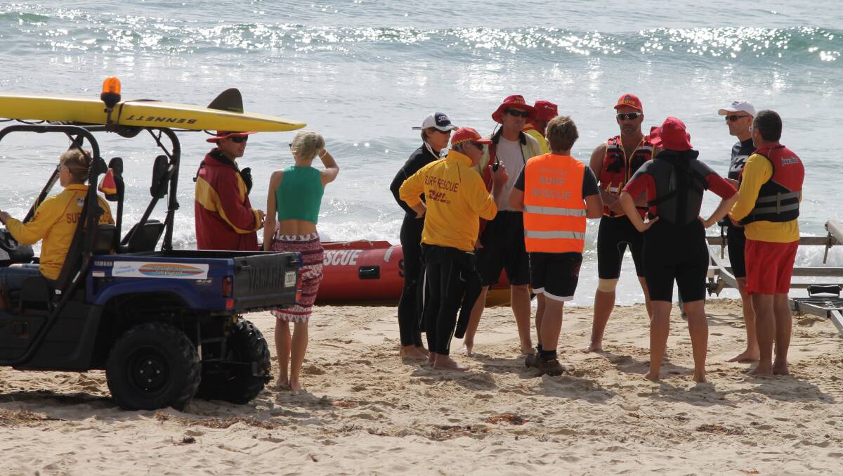 Surf lifesavers and other emergency personnel coordinate a search for Chris Armstrong after April's shark attack.