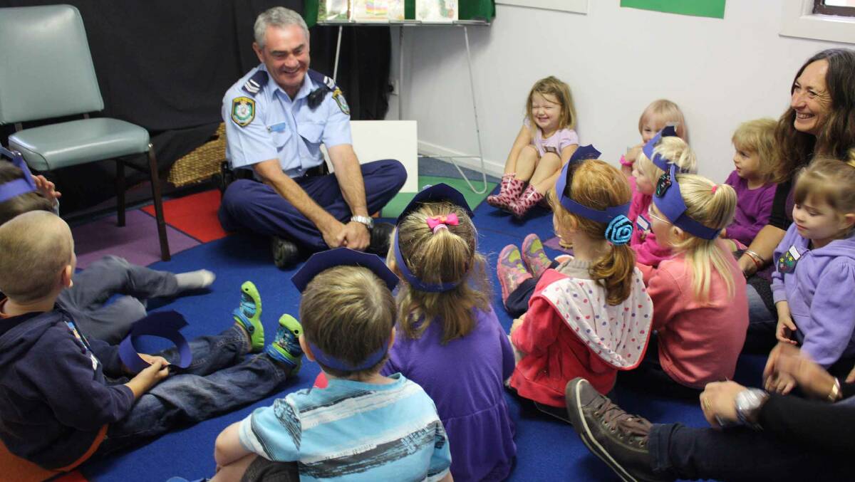 Senior Constable Robert Dunlop chats with the children at Cobargo Preschool.