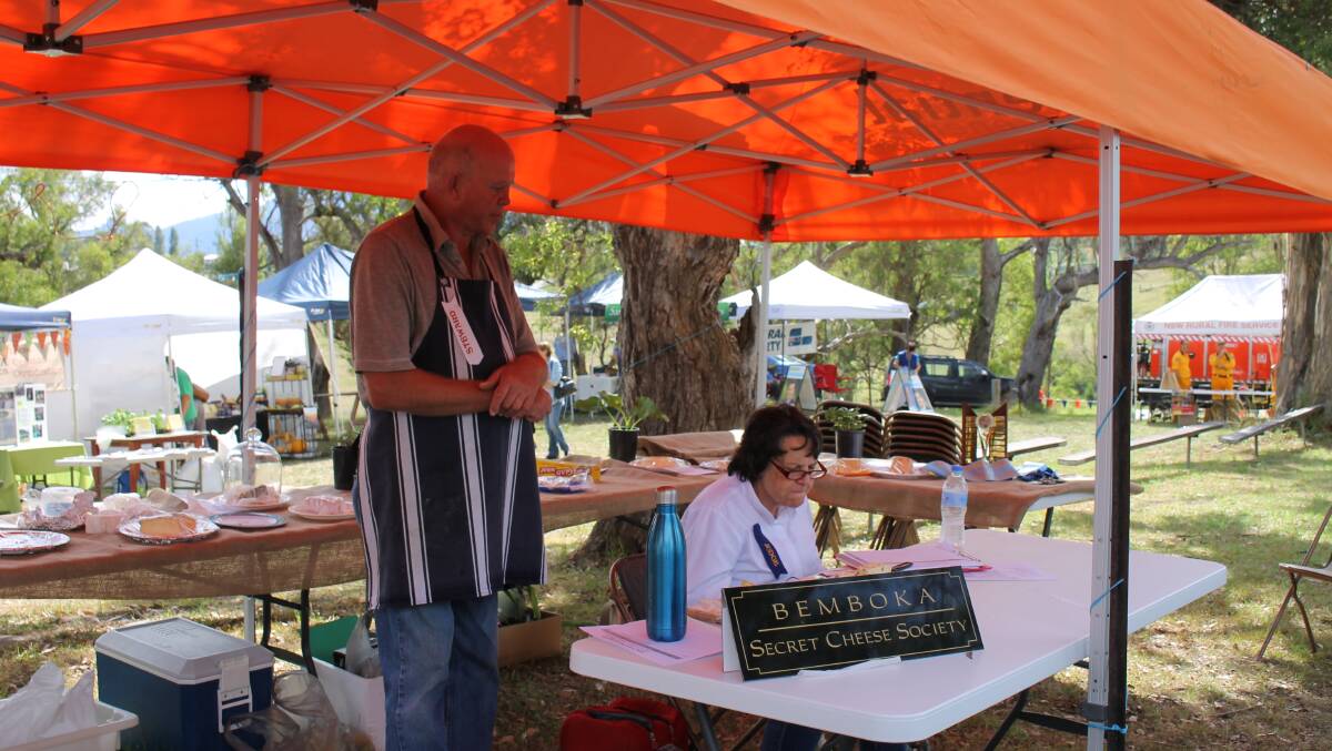 Judging cheese in front of a live audience is Carole Willman (right) assisted by cheese steward Patrick Reubinson.
