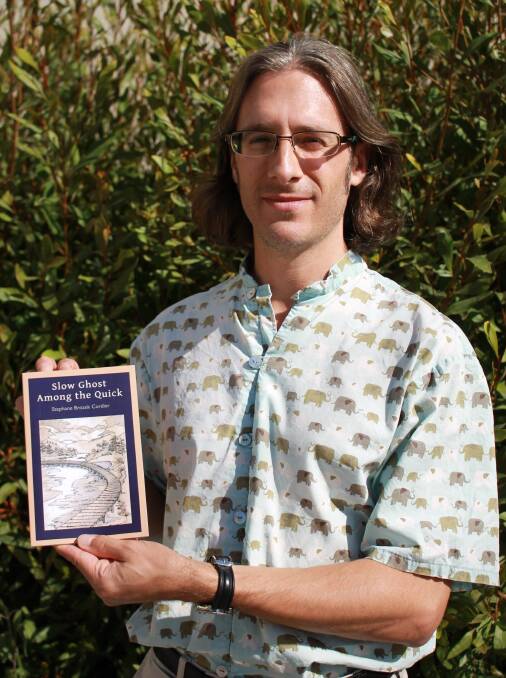 Stephane Cordier holds his new poetry collection, Slow Ghost Among the Quick, which will be launched in Tathra on Thursday.