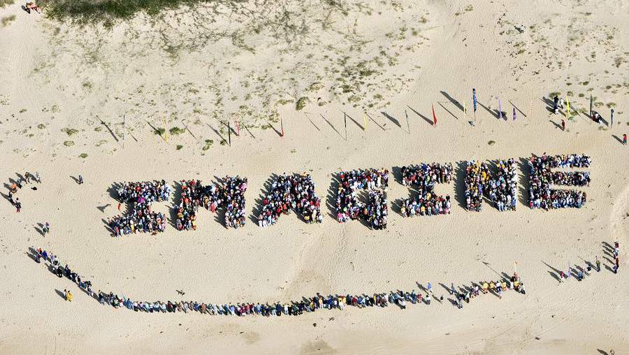Around 3000 people form Clean Energy for Eternity’s first human sign on Tathra Beach in 2006.