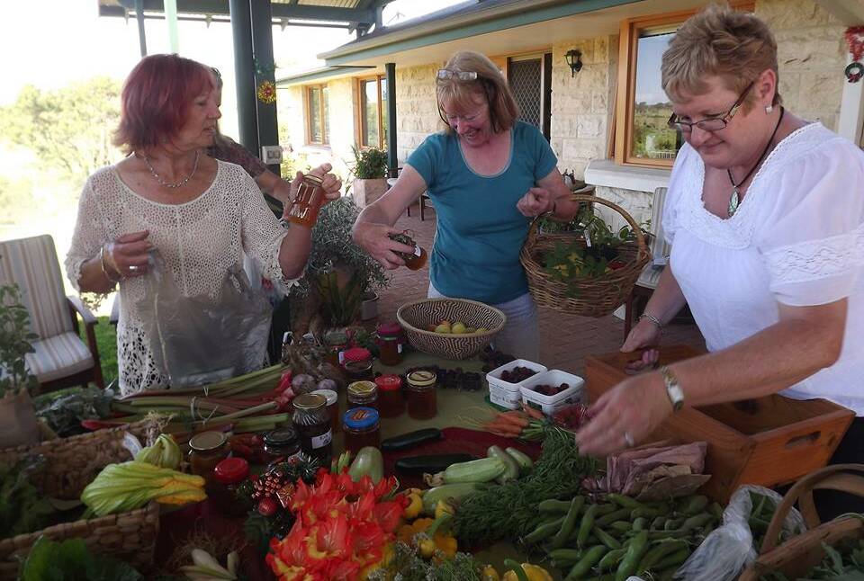 Exchanging produce at a recent Springvale Food Swap are (from left) Linda McMurray, Margaret Essex and Jenny Shevchuk. 