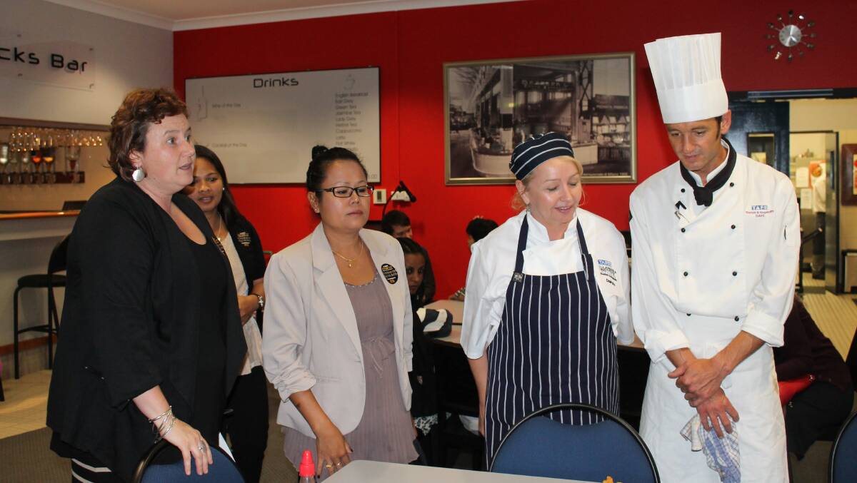 Commercial cookery teacher David Arens (right) quizzes Boonyanuch Skeers (second from left) about a prepared dish learned in her native Thailand, watched by Bega Valley Shire Council’s Emma Benton and TAFE Bega’s head teacher Hospitality and Tourism Deirdre Jory.