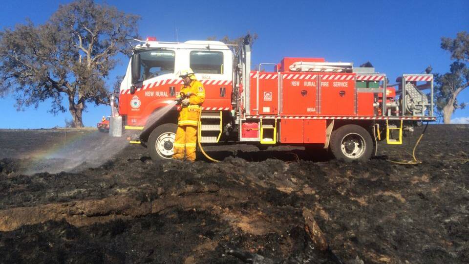 RFS volunteers work to put out a grass fire near Candelo on Tuesday. Photo submitted by Sam Wilton.