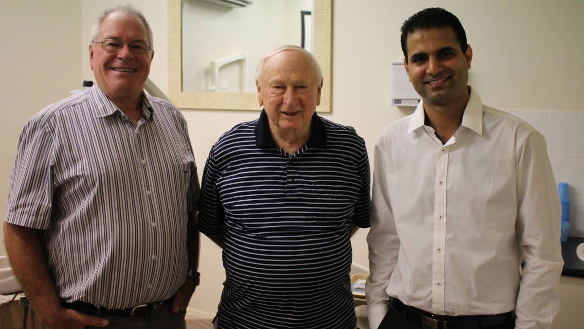 Bega Dental Surgery and Laboratory past and present dentists (from left) Lee O’Neill, Paul Windle and Arvind Chawla share stories in the surgery. 