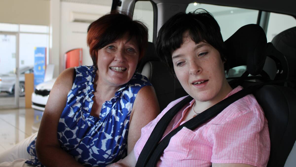 Colleen and Janelle Barrett inside their new car, made possible through a fundraising effort started by the Wyndham Hymn Singers. 