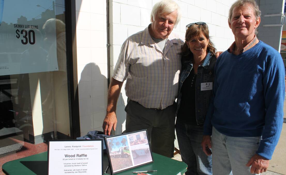 Selling raffle tickets for the Lenno Footprint Foundation wood raffle are (from left) Brian Elliott, Jenny Russell and Ted Lowen.