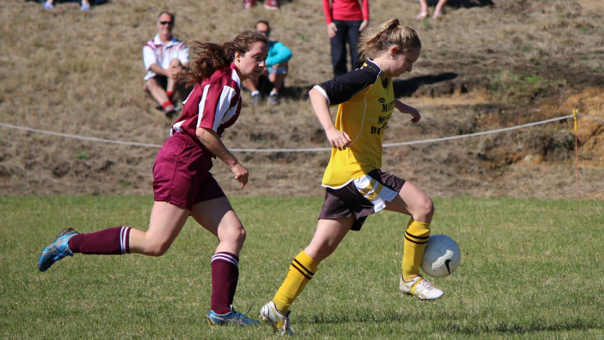• Tigress Amy Legge controls the ball as her Tathra opponent swoops in on Sunday. 