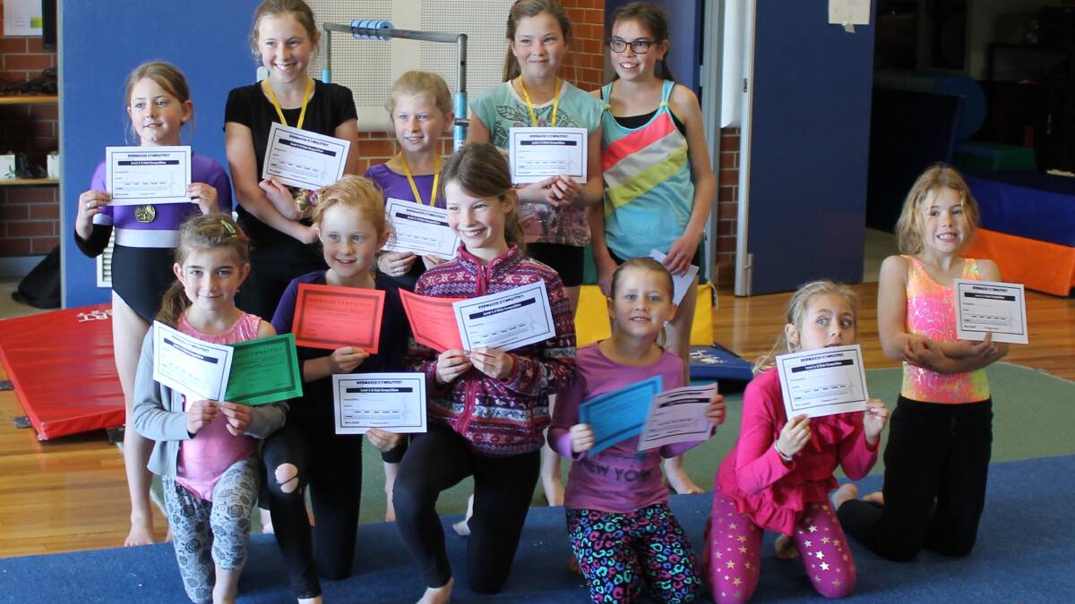 • Celebrating their certificates are (back, from left) Grace Bailey, Ruby Christmass, Charlotte Stubbs, Jasmine Scott, Maeve Leung, (front) Jasinta Puglisi, Phoebe Gilham, Ruby O’Leary, Zoe and Elly White and Chloe Tyrrell. 