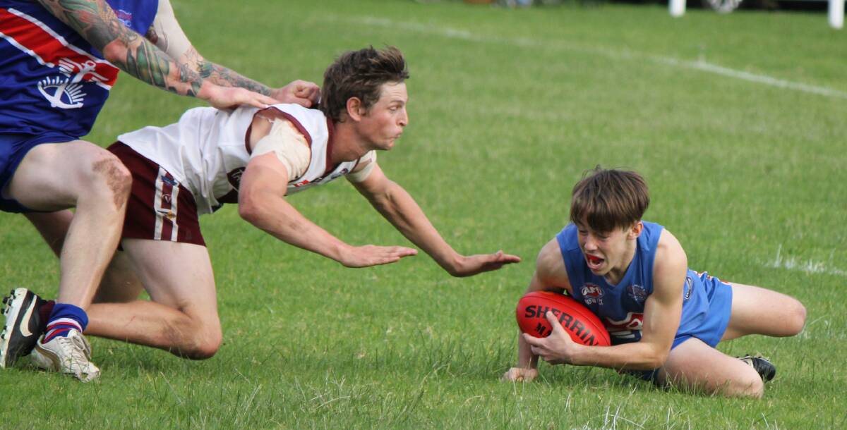 • Sea Eagle Dean Gartside (left) goes for a diving tackle on a Merimbula Diggers opponent recently. 