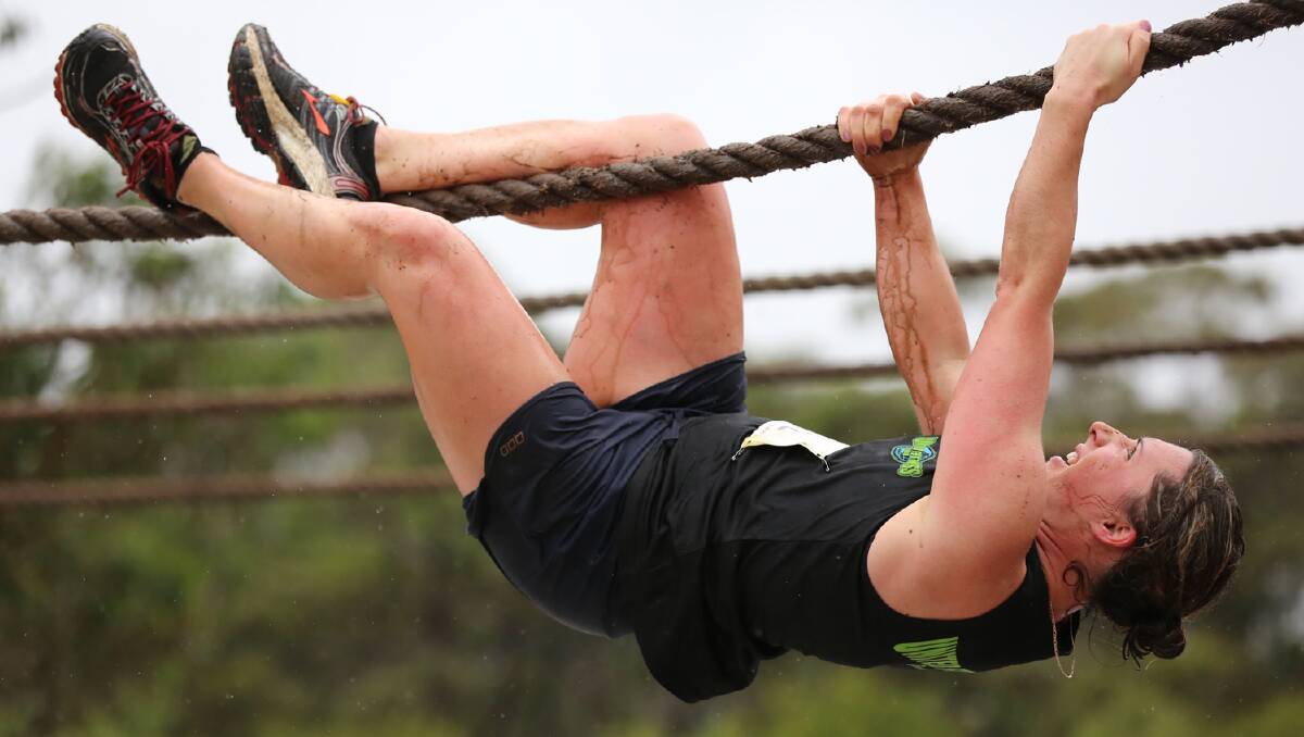 Michelle Walker tackles a rope climb during a recent obstacle course race. 