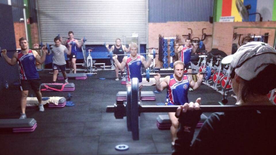 • Roosters take part in a “body bar” training regime at United Fitness on Tuesday night. 
