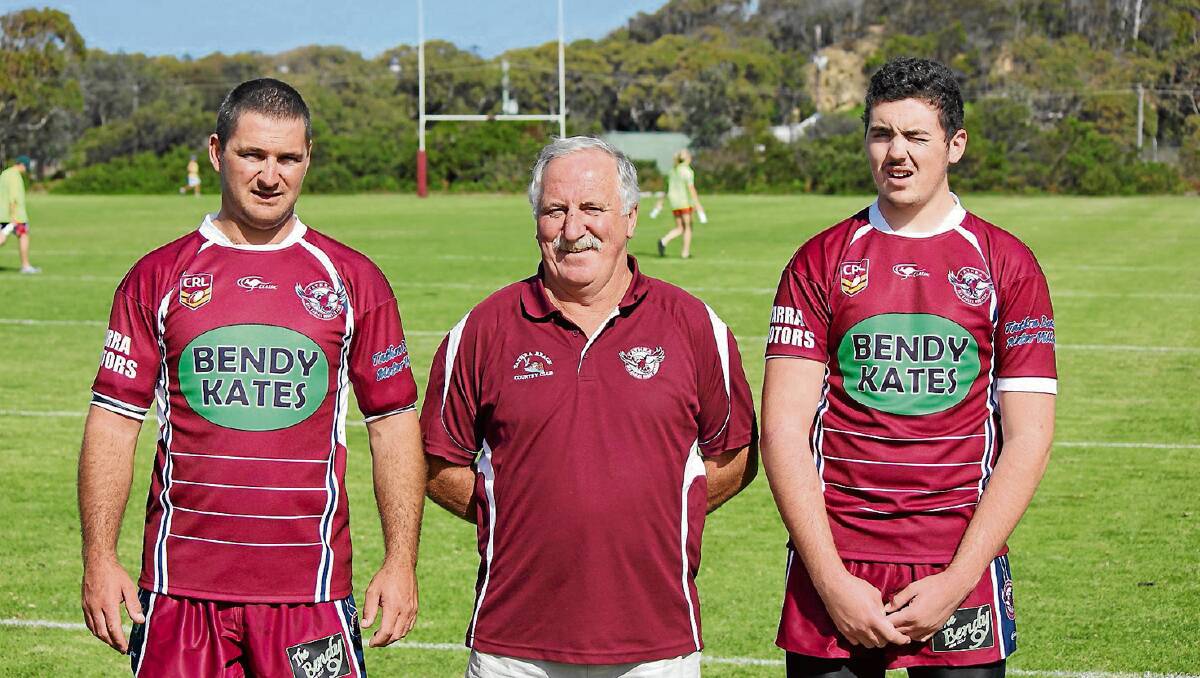 • Tathra Sea Eagles president Chris Sly (centre) with son Luke and grandson Joel Whitby mark three generations of football on Sunday. 