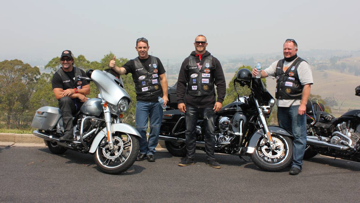 Legends of rugby league taking a break from a motorbike tour of the Far South Coast on Monday are (from left) Nathan Hindmarsh, Brad Fitler, Matt Cooper and Ian Schubert.