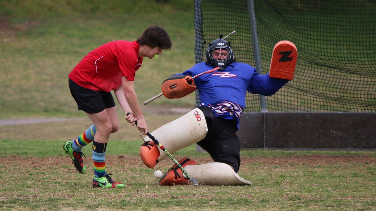 • Grand Hotel’s Jack Hukins (left) goes one-on-one with Pambula goalie Mark Carriage during finals last season. The Grand Hotel is still in contetion across the three senior grades. 