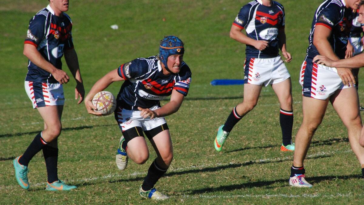 • Bega Rooster Craig Matthews looks determined as he makes a run against the Moruya Sharks on Sunday. 