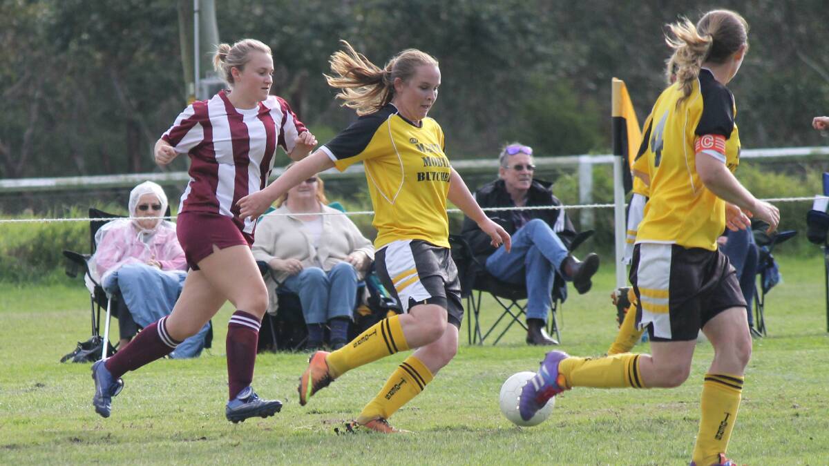 • Tigress Kirsty Whitby-Mcbeath shapes to kick with a Tathra opponent on her heels. 